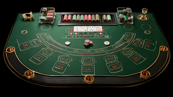 Elegant overhead view of professional baccarat table with betting areas